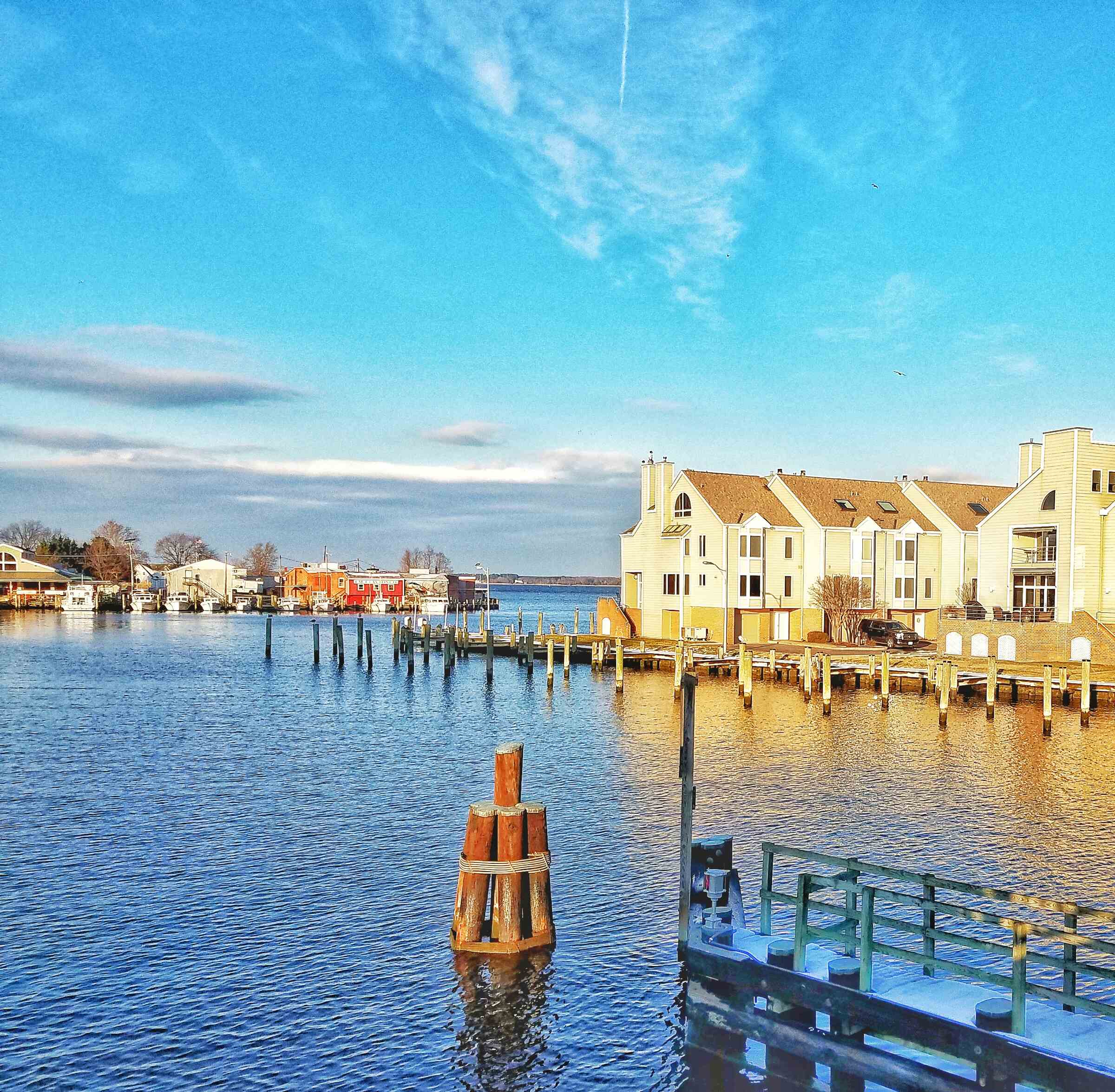 The harbor of Cambridge MD with beautiful blue sky and water