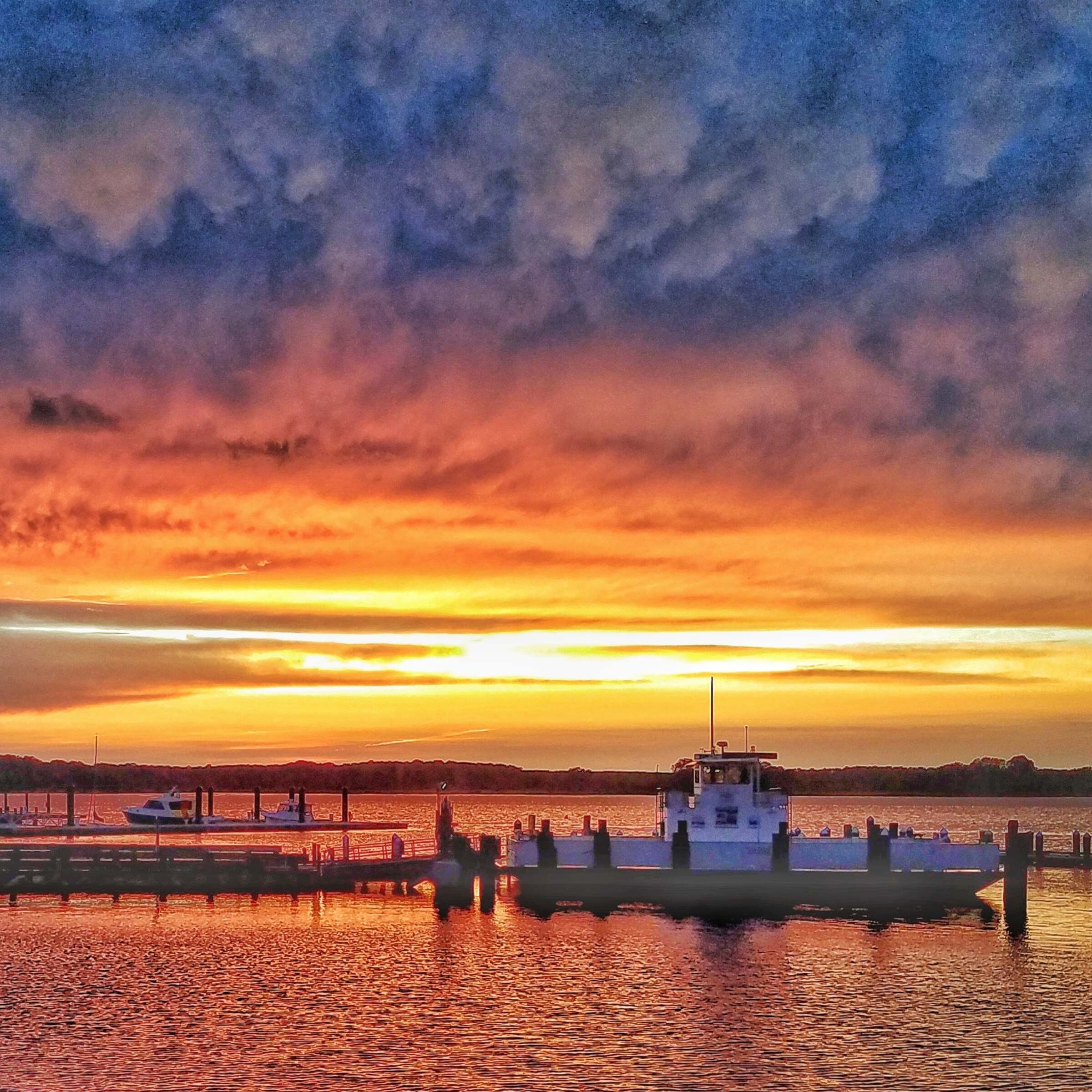 Colorful sunset over the port of Oxford, MD and the ferry