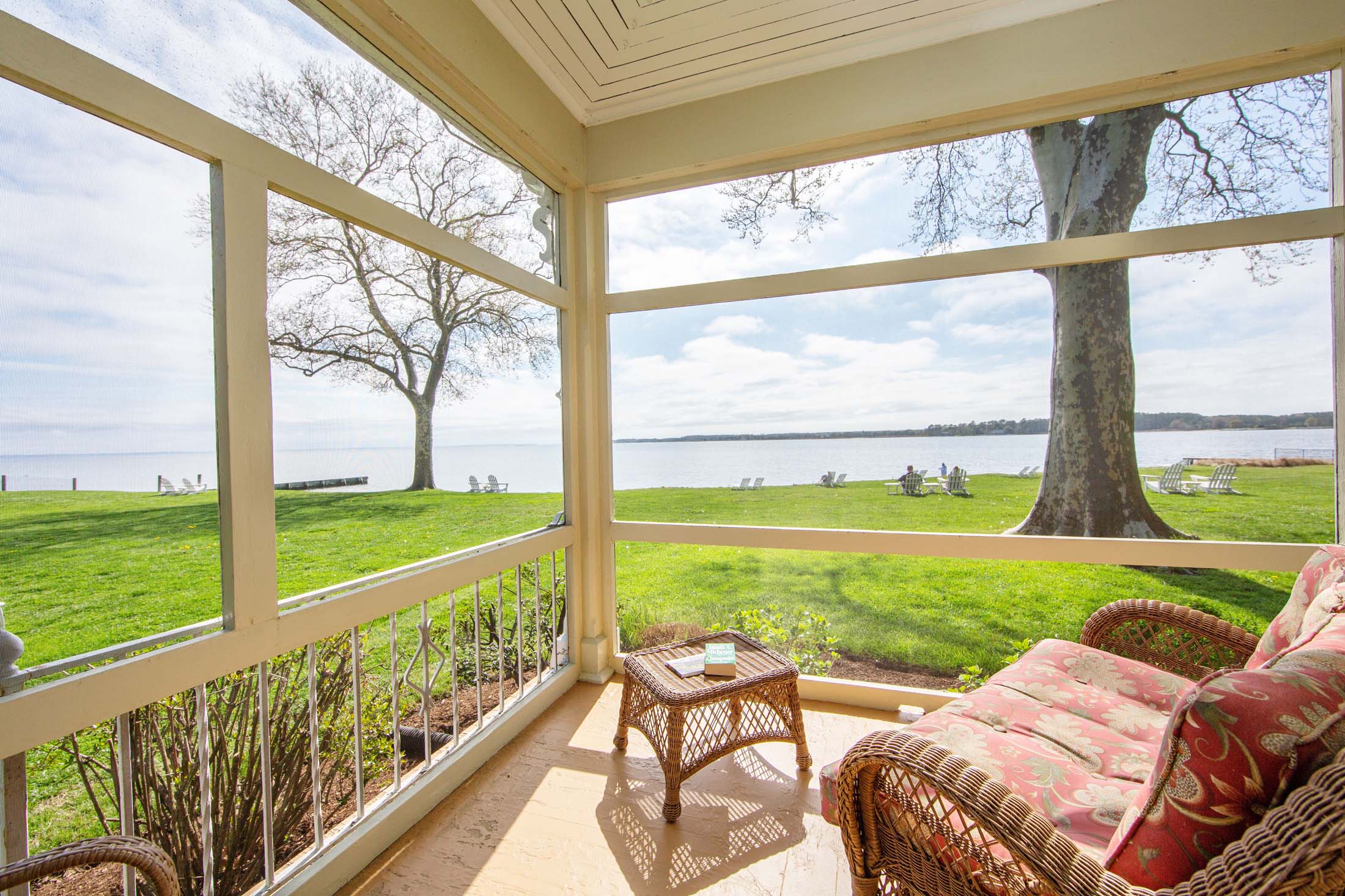Screened Porch with seating and water view